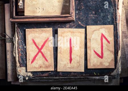 Fortune teller from futhark rune cards on wooden table as a mystical ...
