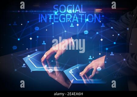 Navigating social networking with SOCIAL INTEGRATION inscription, new media concept Stock Photo