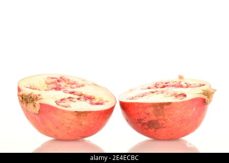 Two halves of organic ripe pomegranates, close-up, isolated on a white background. Stock Photo