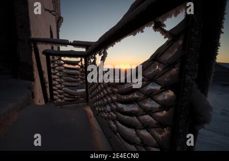 Abandoned hotel. Sunset on a frosty evening Stock Photo