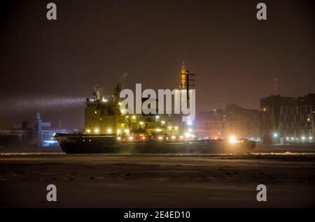 January 2021- Arkhangelsk. The Dikson icebreaker against the background of the city of Arkhangelsk. Russia, Arkhangelsk region Stock Photo