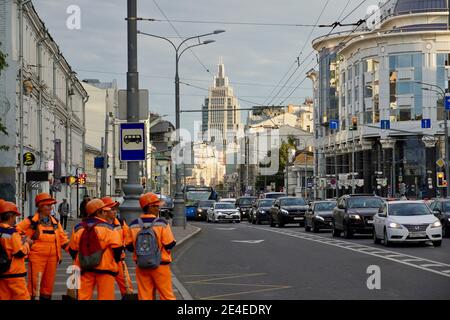 Moscow, Russia - September 2020 Road workers in orange vests on the streets of Moscow. Urban street view. High quality photo Stock Photo