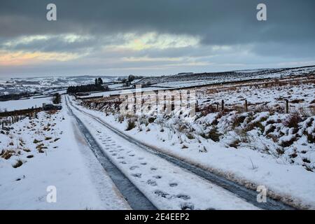 Snow and hazy skies all day and looking North East over Nidderdale in Yorkshire Dales Stock Photo