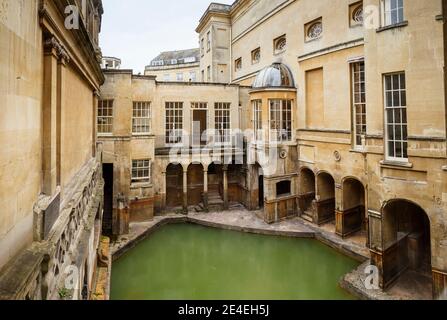 The Sacred Pool at the Roman Baths museum and Pump Room window, a major tourist attraction in the City of Bath, Somerset, south-west England UK Stock Photo