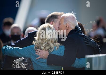 Washington, United States Of America. 20th Jan, 2021. U.S President Joe Biden embraces First Lady Jill Biden and son Hunter Biden during the 59th Presidential Inauguration ceremony at the West Front of the U.S. Capitol January 20, 2021 in Washington, DC Credit: Planetpix/Alamy Live News Stock Photo