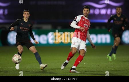 Cheltenham Town's Conor Thomas (right) and Manchester City's Phil Foden in action during the Emirates FA Cup fourth round match at the Jonny-Rocks Stadium, Cheltenham. Picture date: Saturday January 23, 2021.