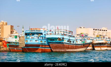Dubai, UAE - January 31, 2020: Traditional arabian Dhow boats on the berth in Deira in Dubai, United Arab Emirates Stock Photo