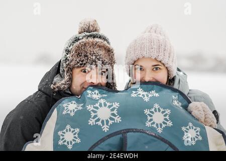 Portrait of smiling couple in love. Young happy couple walking in winter Stock Photo