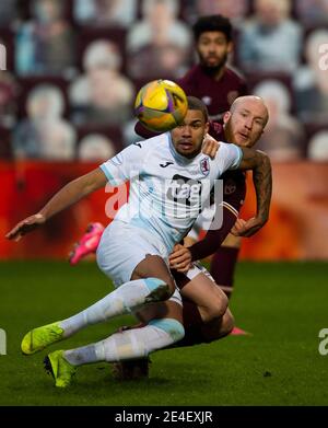 Scottish Championship - Heart of Midlothian v Raith rovers. Tynecastle Park, Edinburgh, Midlothian, UK. 23rd Jan, 2021. Hearts play host to Raith Rovers in the Scottish Championship at Tynecastle Park, Edinburgh. Pic shows: Raith Rovers' defender, Frankie Musonda, manages to block as Hearts' Irish International, Liam Boyce, bears down. Credit: Ian Jacobs/Alamy Live News Stock Photo