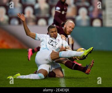 Scottish Championship - Heart of Midlothian v Raith rovers. Tynecastle Park, Edinburgh, Midlothian, UK. 23rd Jan, 2021. Hearts play host to Raith Rovers in the Scottish Championship at Tynecastle Park, Edinburgh. Pic shows: Raith Rovers' defender, Frankie Musonda, manages to block as Hearts' Irish International, Liam Boyce, bears down. Credit: Ian Jacobs/Alamy Live News Stock Photo