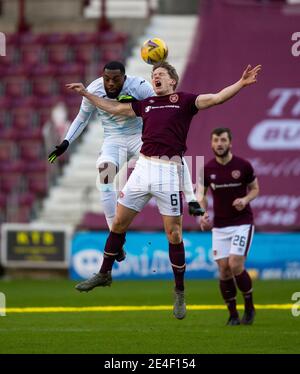 Scottish Championship - Heart of Midlothian v Raith rovers. Tynecastle Park, Edinburgh, Midlothian, UK. 23rd Jan, 2021. Hearts play host to Raith Rovers in the Scottish Championship at Tynecastle Park, Edinburgh. Pic shows: Raith Rovers' forward, Gozie Ugwu, and Hearts' Centre-Back, Christophe Berra, go up for the ball. Credit: Ian Jacobs/Alamy Live News Stock Photo