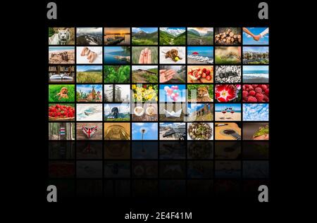 Screens forming a big multimedia broadcast video wall - broadcasting and multimedia concept Stock Photo