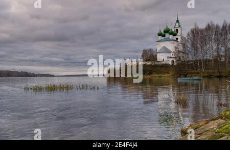 Church of the Holy Trinity in the village of Dievo Gorodishche. Early gloomy morning on the Bank of the Volga river in Yaroslavl region, Russia. Stock Photo