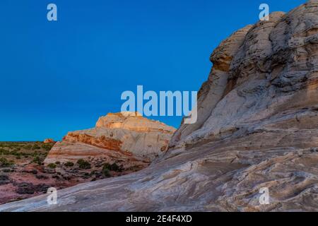 First light on the Navajo Sandstone formations of White Pocket, Vermilion Cliffs National Monument, Arizona, USA Stock Photo