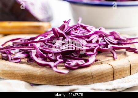 Sliced fresh red cabbage on cutting board. Stock Photo