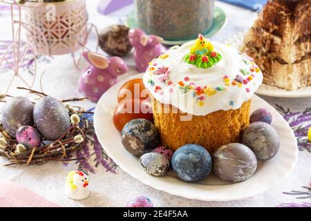 Festive Easter table setting. Easter orthodox cakes with Easter eggs. Stock Photo