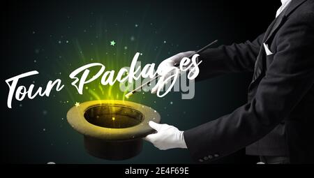 Magician is showing magic trick with Tour Packages inscription, traveling concept Stock Photo