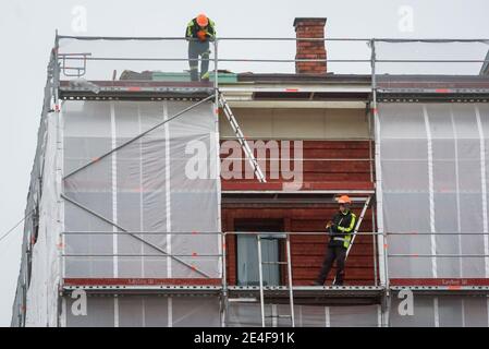 RIGA, LATVIA. 14th December 2020. Workers on scaffold at Powder Tower in Riga, Latvia. Stock Photo