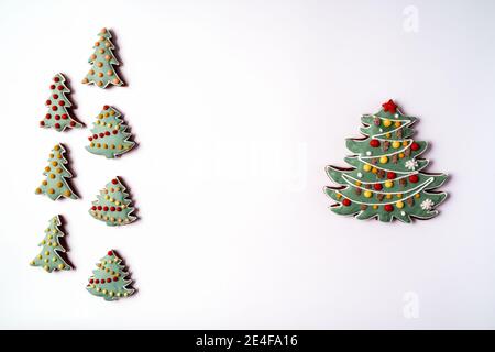 Festive Christmas and New Year gingerbread in the shape of fir tree,flat lay, isolated on white background. Stock Photo
