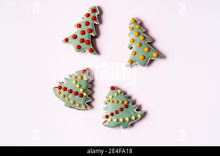 Festive Christmas and New Year gingerbread in the shape of fir tree,flat lay, isolated on white background. Stock Photo