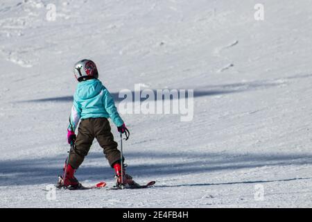 Little child skiing in Shahdag Ski Resort. Gusar - Azerbaijan: January 2019. Stock Photo