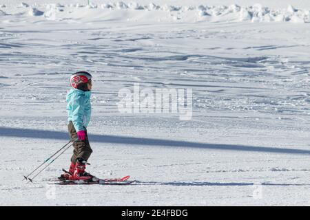 Little child skiing in Shahdag Ski Resort. Gusar - Azerbaijan: January 2019. Stock Photo