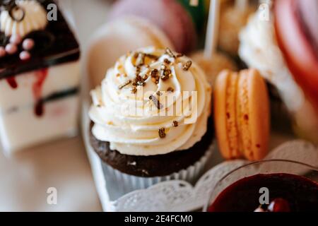 Candy bar on a wedding party with colorfull cakes and fruits Stock Photo