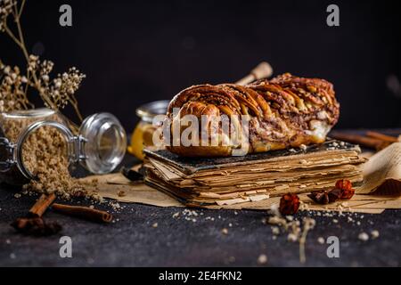 Swirl brioche or traditional Polish babka cake with walnut, apple and honey Stock Photo