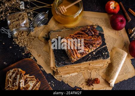 Swirl brioche or traditional Polish babka cake with walnut, apple and honey Stock Photo