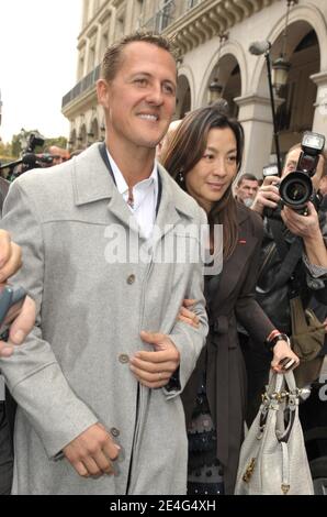 Seven-times Formula One world champion and adviser for Scuderia Ferrari, German Michael Schumacher and Michelle Yeoh arriving at the hotel Westin in Paris, France on October 23, 2009. Jean Todt was elected president of motor racingÀs governing body FIA beating Finnish candidate Ari Vatanen. Todt was the big favorite after getting backing from outgoing FIA president Max Mosley and Formula One boss Bernie Ecclestone. The 63-year-old Frenchman was elected to a four-year term, beating Vatanen 135-49 in the voting at FIAÀs annual general meeting in Paris. The FIA said 12 votes were ruled as invalid Stock Photo