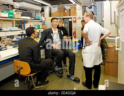 EXCLUSIVE. Turk Sultan Kosen, who is the current record holder of the tallest living man in the world as recognised by Guinness World Records, alongside Dutch endocrinologist Wouter de Herder, Chairman The European Neuroendocrine Tumor Society (ENETS), tries on made-to-measure shoes at Erasmus MC hospital in Rotterdam, The Netherlands on November 9, 2009. The shoes are made by German shoe manufacturer Georg Wessels. Sultan is in Holland as part of a world tour to promote the Guinness Book of Records 2010. Born on September 27, 1982 in eastern Turkey, Sultan is 2,46 m tall et has shoe size 60. Stock Photo