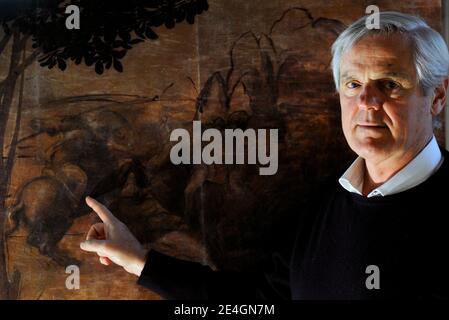 Italian art expert Maurizio Seracini in his office in front of a detail of Leonardo's 'The Adoration of the Magi'. Seracini says he is on the verge of discovering a long-lost Leonardo da Vinci masterpiece 'The Battle of Anghiari' hidden in a secret cavity behind a palace wall in Florence, Italy. Seracini used thermographic, ultra sound, ultra-violet and infra-red diagnostic techniques to concludes that only the underdrawing had been done by Leonardo da Vinci, the paint surface having been added latter by another artist. And the horseman seems a study for The Battle of Anghiari. Photo by Eric V Stock Photo