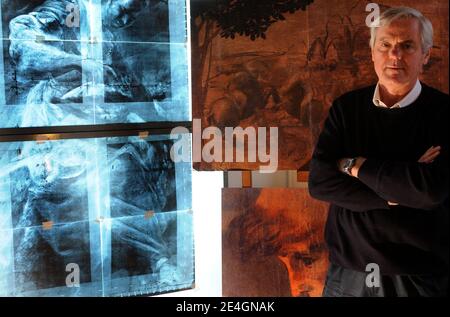 Italian art expert Maurizio Seracini in his office in front of a detail of Leonardo's 'The Adoration of the Magi'. Seracini says he is on the verge of discovering a long-lost Leonardo da Vinci masterpiece 'The Battle of Anghiari' hidden in a secret cavity behind a palace wall in Florence, Italy. Seracini used thermographic, ultra sound, ultra-violet and infra-red diagnostic techniques to concludes that only the underdrawing had been done by Leonardo da Vinci, the paint surface having been added latter by another artist. And the horseman seems a study for The Battle of Anghiari. Photo by Eric V Stock Photo