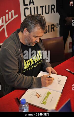 'French film director Luc Besson signs copies of his latest animated film ''Arthur and the Revenge of Maltazard'' at the Virgin Mega store in Paris, France on December 9, 2009. Photo by Morgan Dessalles/ABACAPRESS.COM' Stock Photo