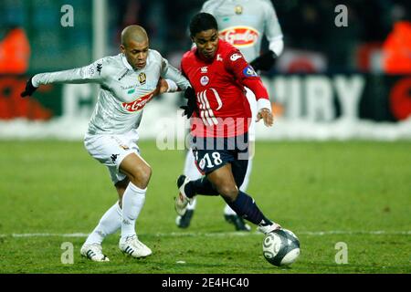 Lille's Franck Beria fights for the ball with Le Mans' Badara Sene during the French First League soccer match, Lille OSC (LOSC) vs Le Mans (LMUC 72) at Lille Metropole Stadium in Lille, north of France on december 20, 2009. Lille won 3-0. Photo by Mikael Stock Photo