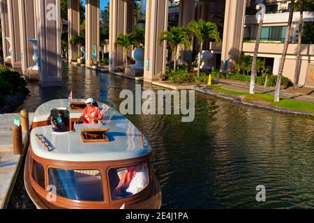 Canal Boats Provide Transportation and Sightseeing Around The Property at The Hilton Waikoloa Village , Waikoloa, Hawaii, USA Stock Photo