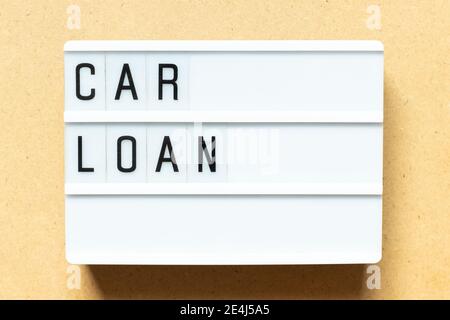 Lightbox with word car loan on wood background Stock Photo