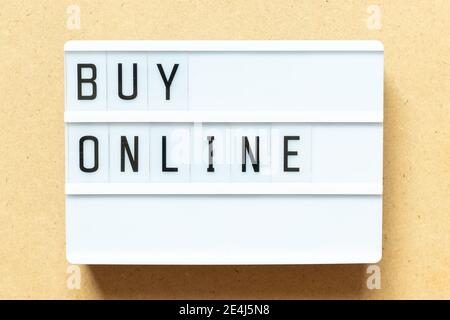 Lightbox with word buy online on wood background Stock Photo