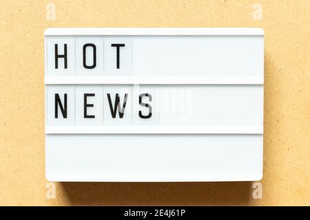 Lightbox with word hot news on wood background Stock Photo