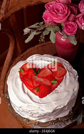 Homemade cream layer cake, fresh, colorful, and delicious dessert with juicy strawberries, sweet whipped cream and cream cheese Stock Photo