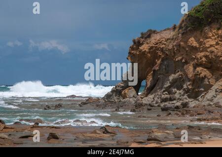 Waves breaking on the Western Port beach at Kilcunda, South Gippsland, Victoria, Australia Stock Photo