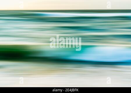 Abstract seascape background. Stormy ocean in deep green and turquoise colors, motion blur Stock Photo