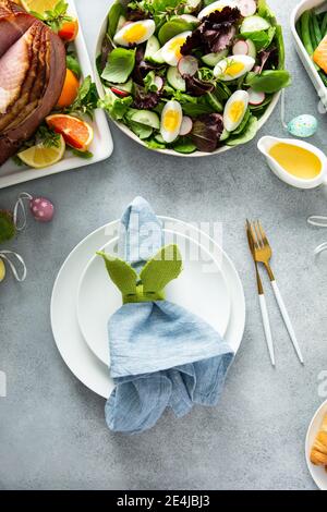Easter brunch table setting with a napkin on a plate Stock Photo