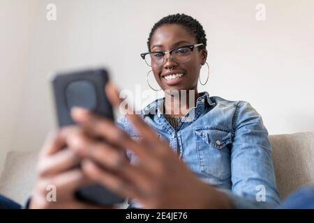 Smiling woman having video call Stock Photo