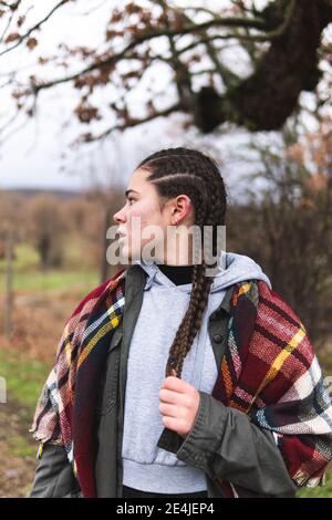 Braided teenage girl in Autumn landscape Stock Photo