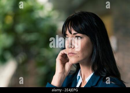Elegant female entrepreneur looking away Stock Photo