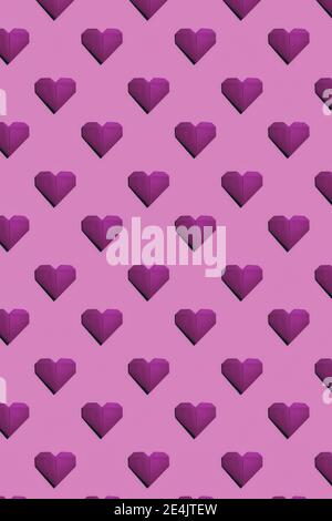 Magenta paper hearts on pink background Stock Photo