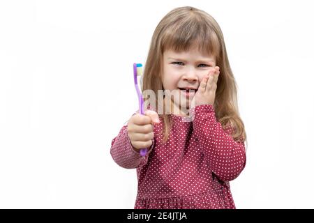child has pain when brushing teeth. isolate on white background Stock Photo