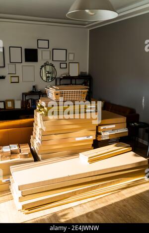 Stack of carton boxes at home on sunny day Stock Photo