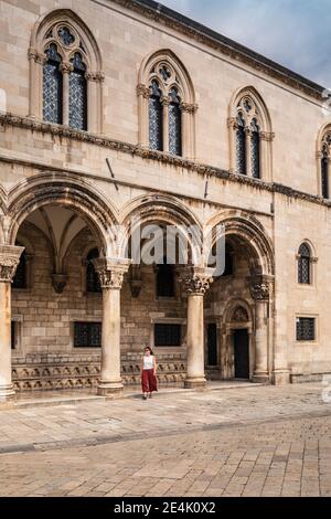 Croatia, Dubrovnik, Woman at Sponza Palace Stock Photo